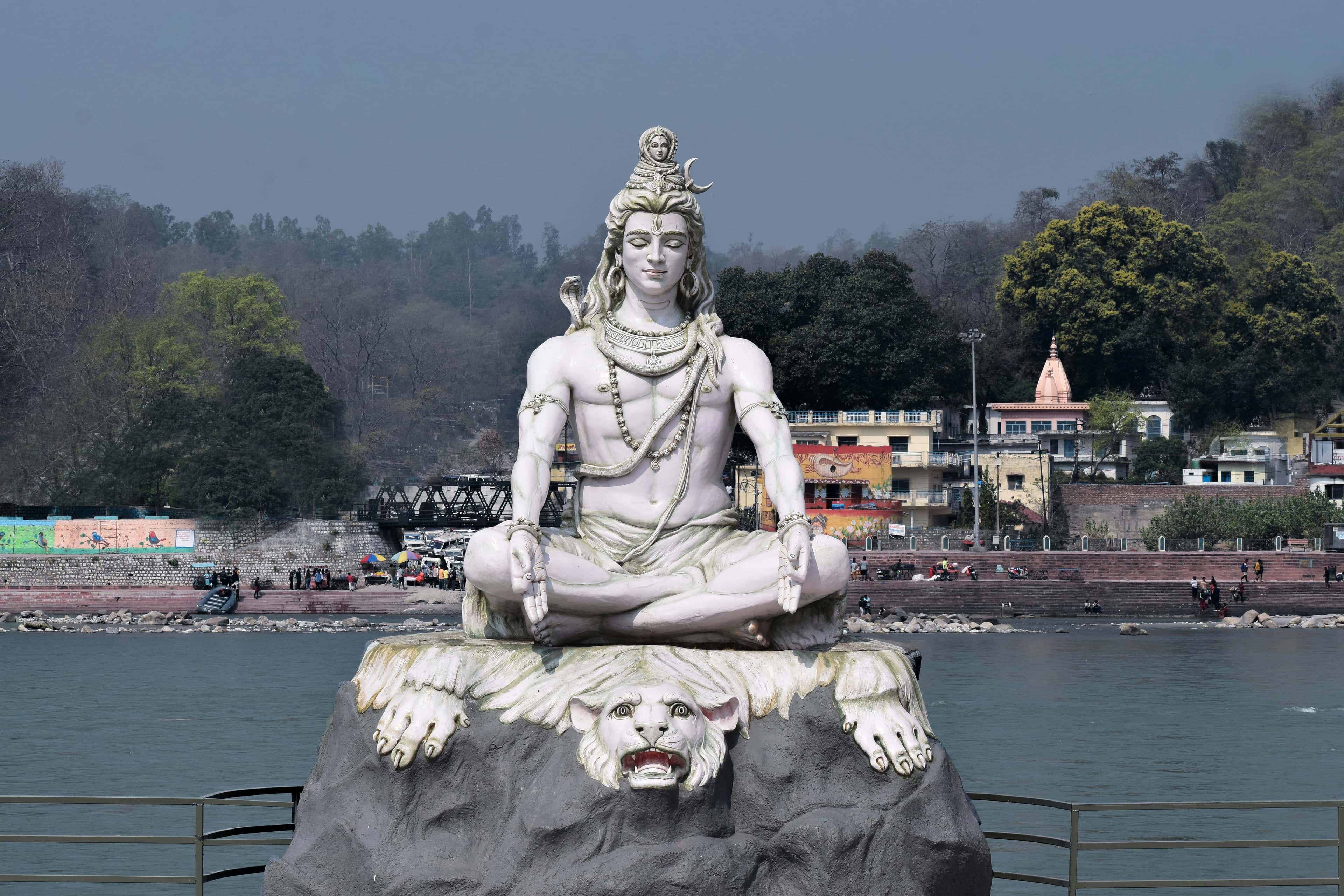 Shiva statue on a rock in the Ganga, Rishikesh