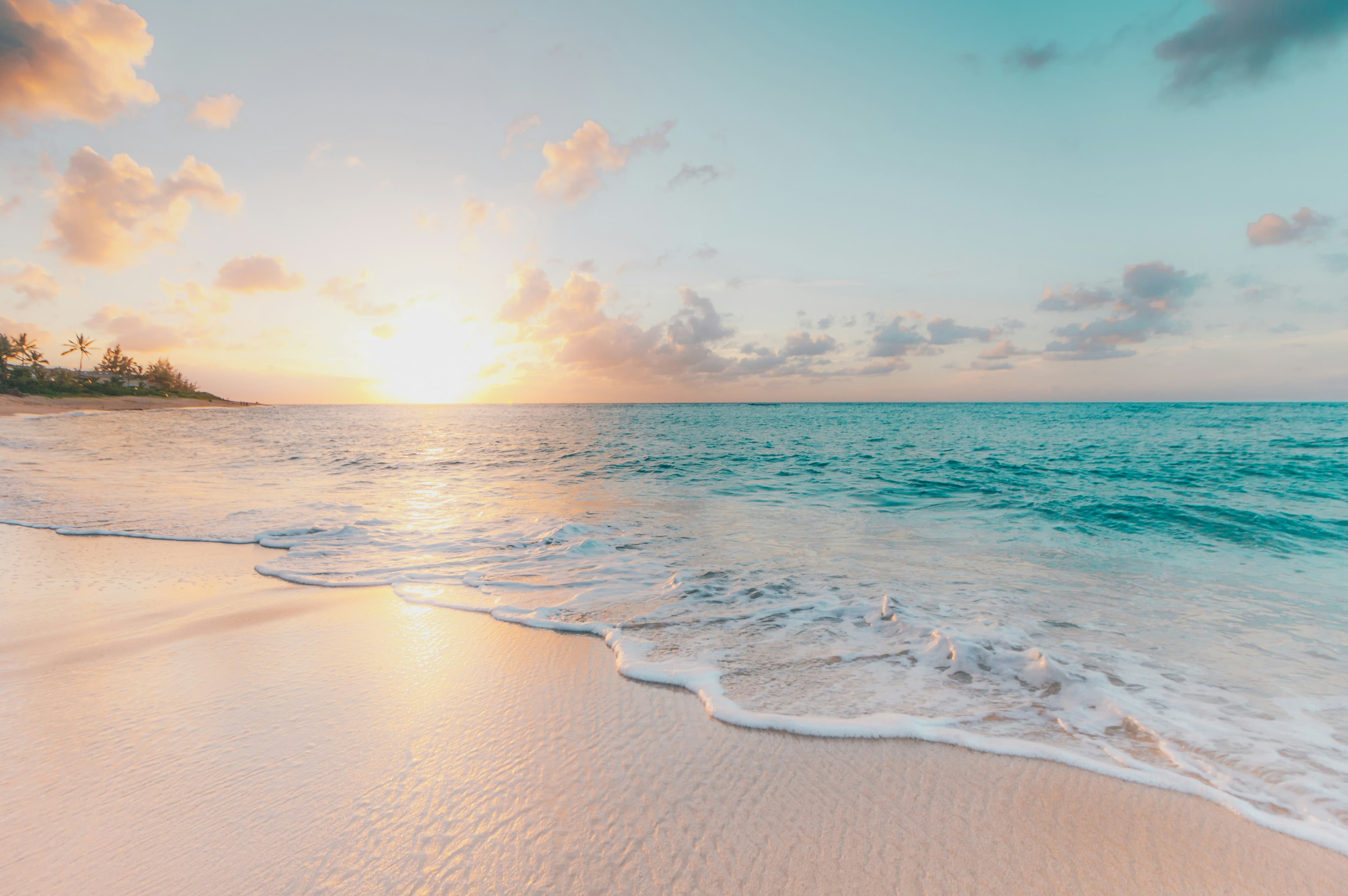 Soft waves on a beach at golden hour