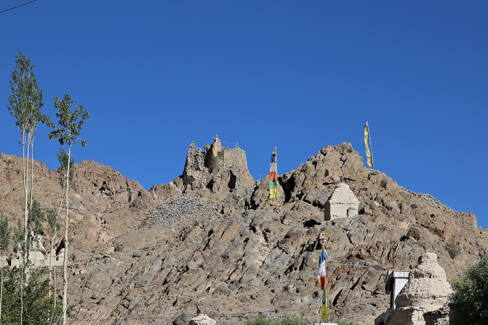 Ruins of Sabu castle on the rocky ridge above Saboo village