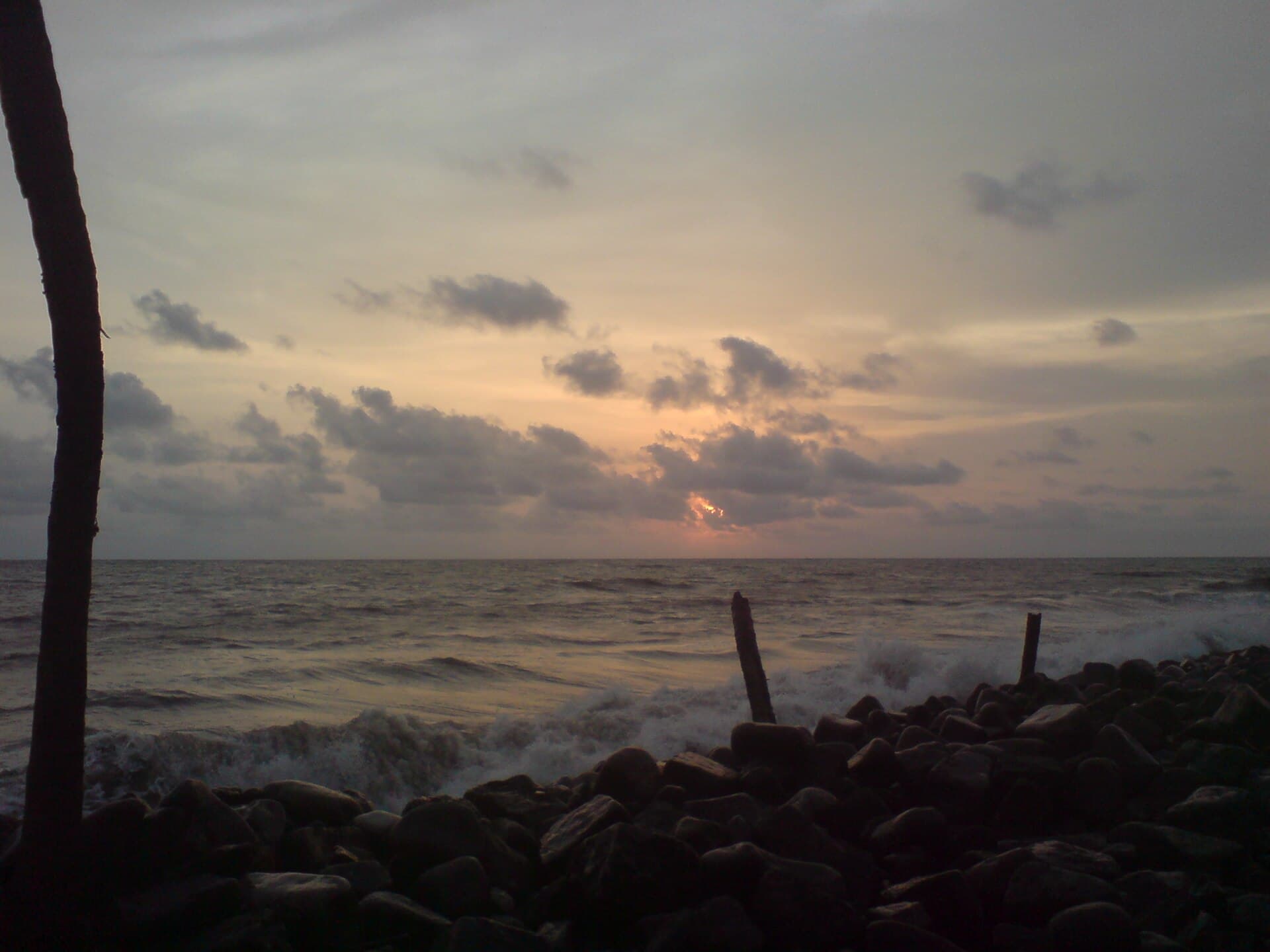 Sunset over the rocky shore at Nattika beach