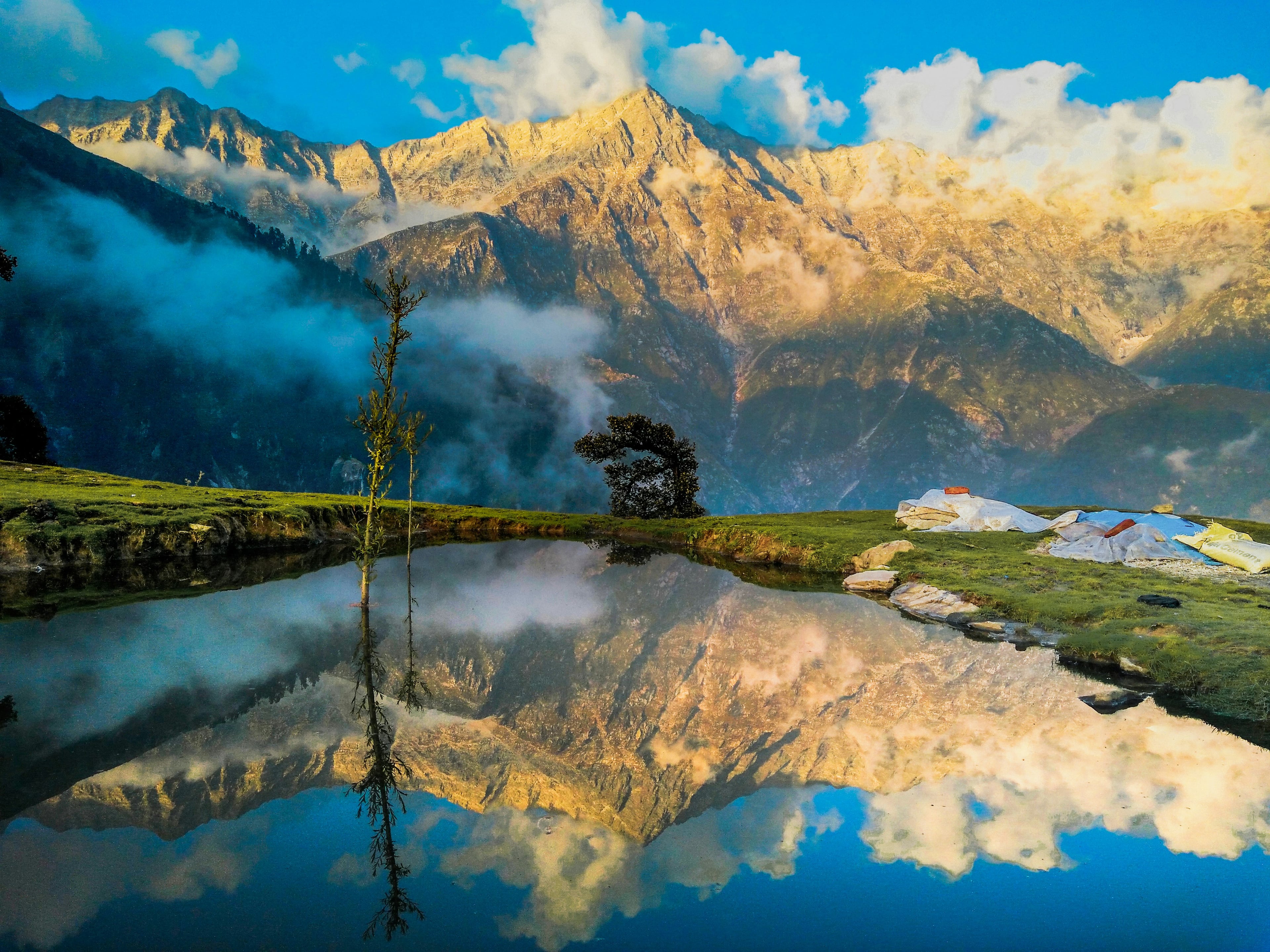 Mountain reflected in a still alpine lake