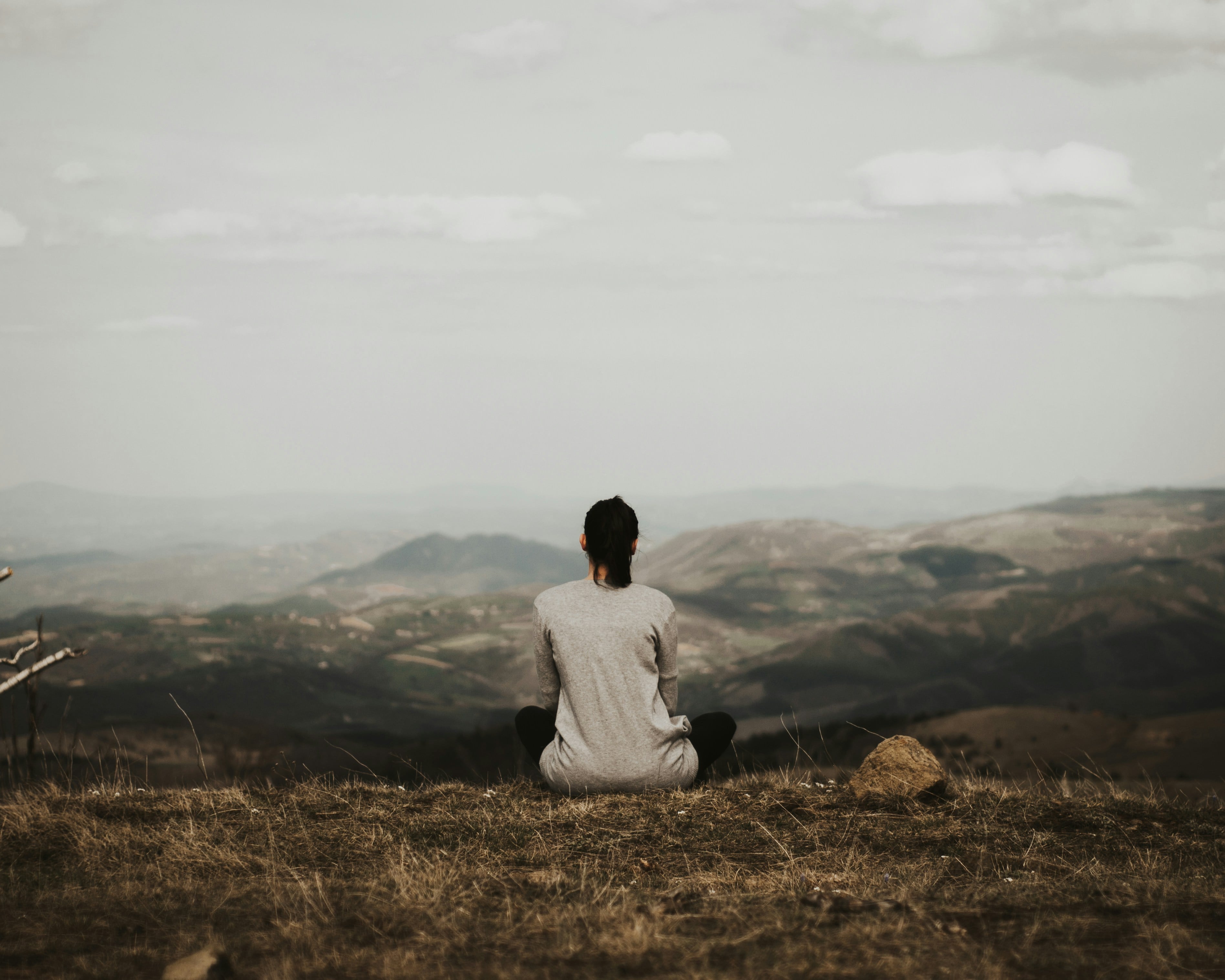 Sitting in stillness above a misty valley