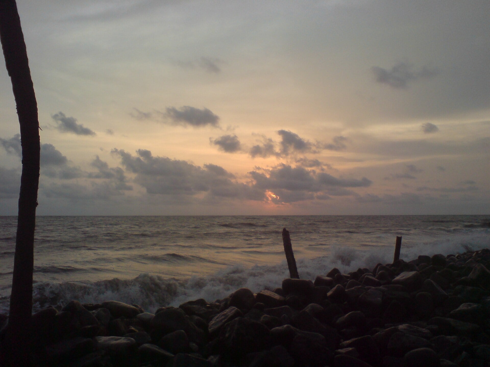 Sunset over the rocky shore at Nattika beach